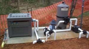 Image of a pool filter and pump system being serviced and maintained by a professional technician from Downriver Pool Service in Dearborn, MI